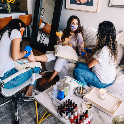 Long Island City, NY 7/19/2020 Genesis Aguirre (left) and Marianella Aguirre (right) of Green Spa perform services on Ashley Lauren Barton (center) in her apartment. Photograph by Nina Westervelt.