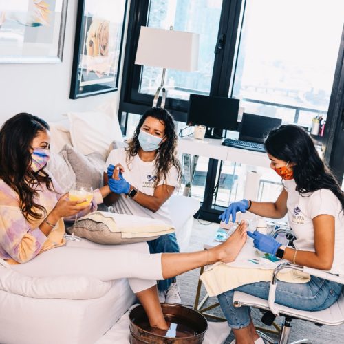 Long Island City, NY 7/19/2020 Genesis Aguirre (right) and Marianella Aguirre (center) of Green Spa perform services on Ashley Lauren Barton (left) in her apartment. Photograph by Nina Westervelt.